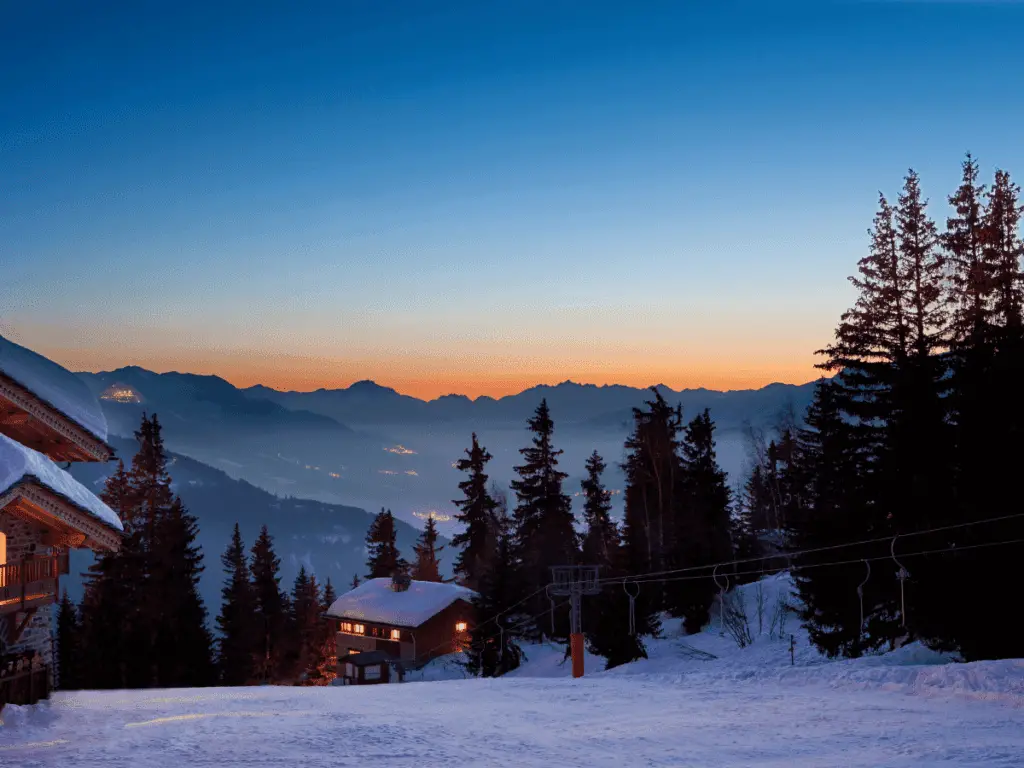 Picture of ski-in ski-out accomodation on a ski slope in the evening